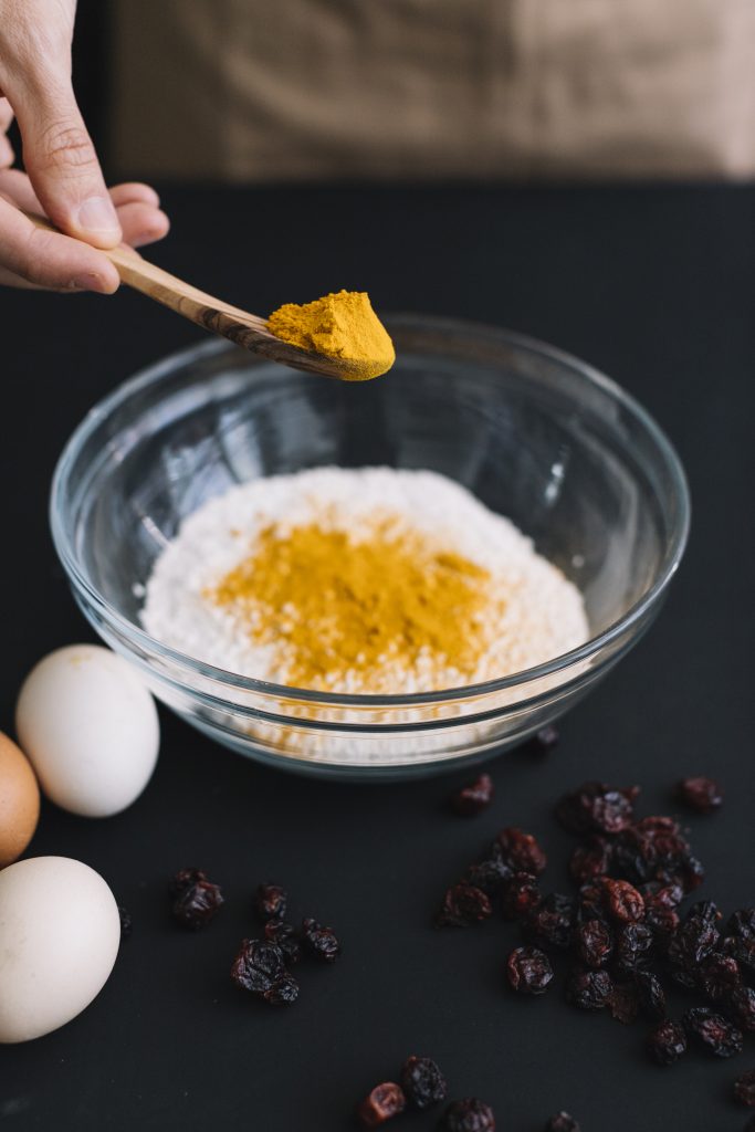 A bowl of yogurt and turmeric paste, used as one of the natural remedies to get rid of black neck.

